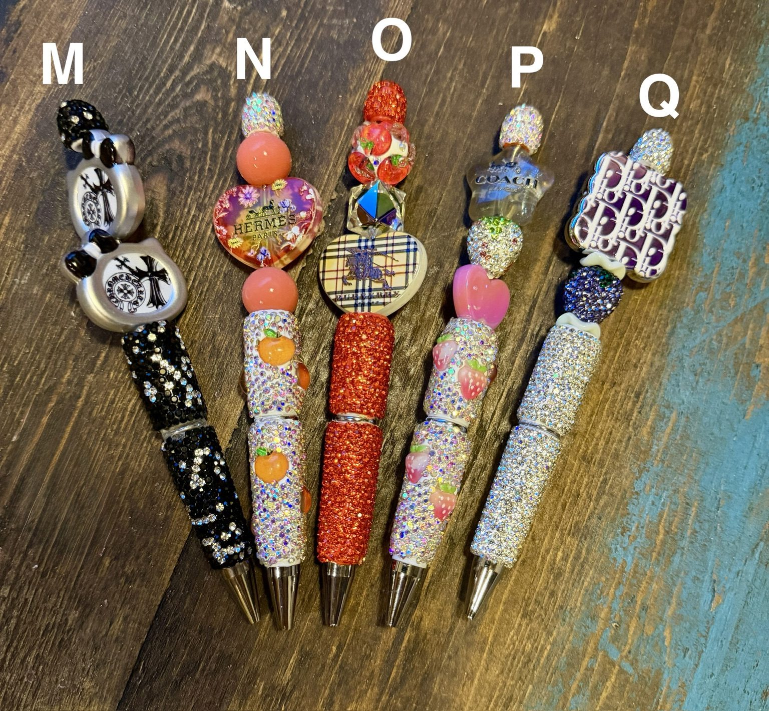Boutique Glam Bling Pens labeled M through Q